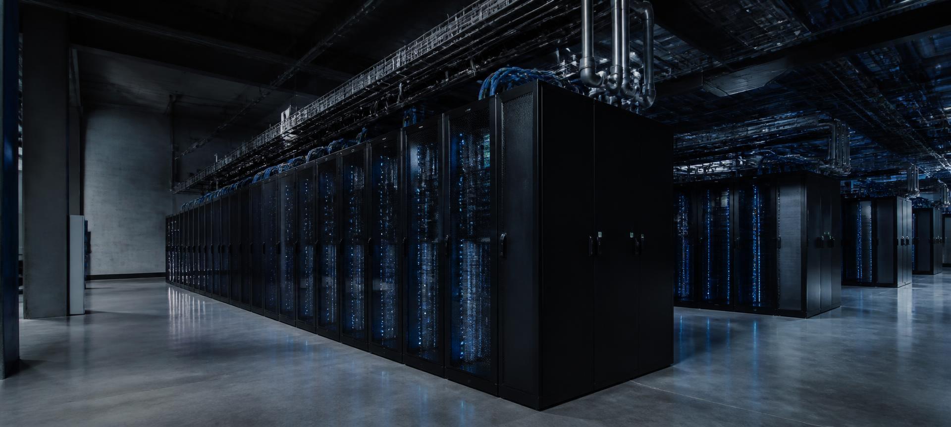Wide interior view of a modern high-density AI data center hall